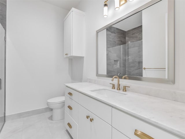 bathroom featuring tile patterned flooring, toilet, vanity, baseboards, and a stall shower