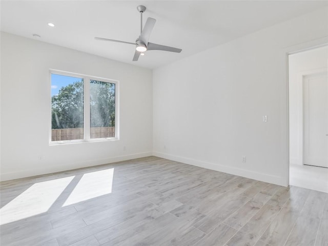 unfurnished room with light wood-style floors, recessed lighting, ceiling fan, and baseboards