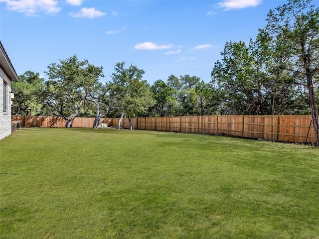 view of yard with a fenced backyard