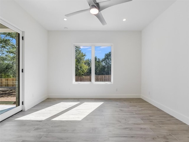 unfurnished room featuring light wood-style floors, recessed lighting, baseboards, and a ceiling fan