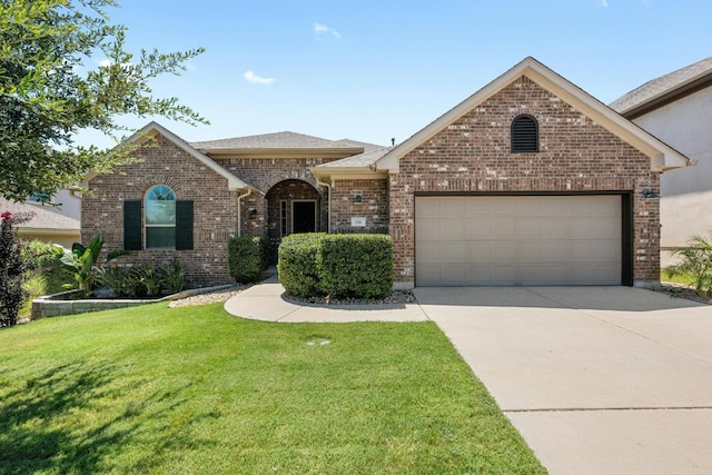 view of front of house featuring an attached garage, brick siding, concrete driveway, roof with shingles, and a front lawn