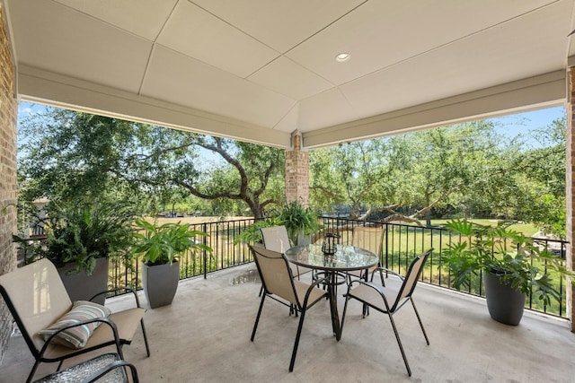 view of patio / terrace with outdoor dining area and a balcony