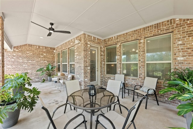 view of patio featuring a ceiling fan and outdoor dining space