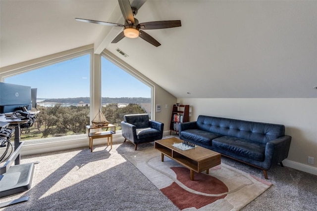 carpeted living area with lofted ceiling with beams, baseboards, and visible vents