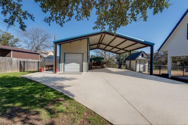 view of parking / parking lot with driveway and fence