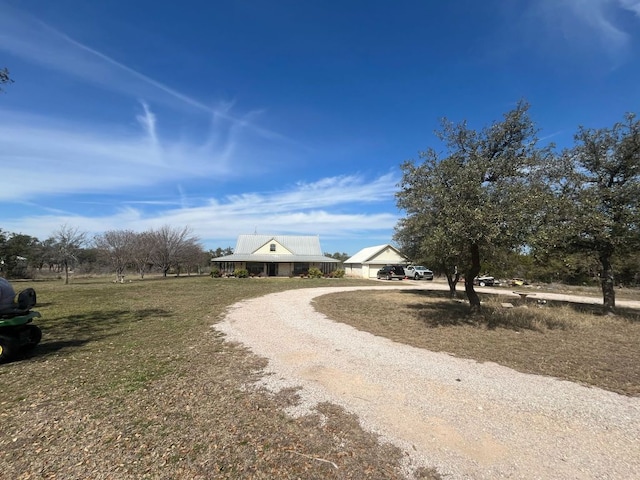 view of street featuring gravel driveway