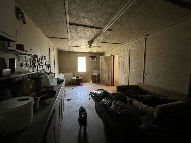 miscellaneous room featuring concrete flooring and a wall unit AC