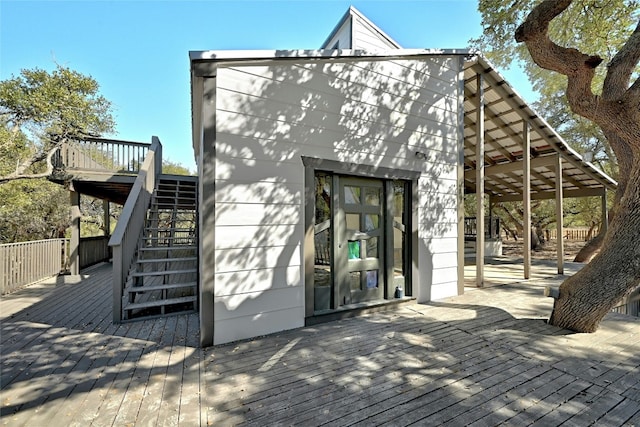 exterior space featuring stairs and a deck