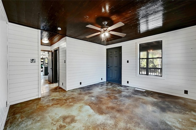 interior space with a patio and a ceiling fan