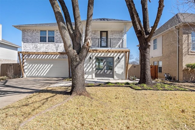 view of front of property featuring brick siding, concrete driveway, an attached garage, fence, and a balcony