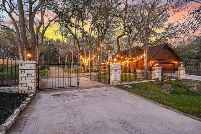 view of gate featuring a fenced front yard