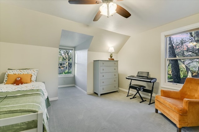 bedroom featuring lofted ceiling, carpet floors, baseboards, and a ceiling fan