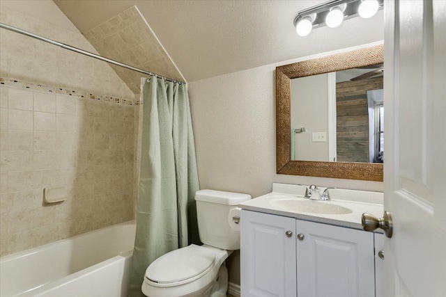 bathroom with vaulted ceiling, shower / bath combo, vanity, and toilet
