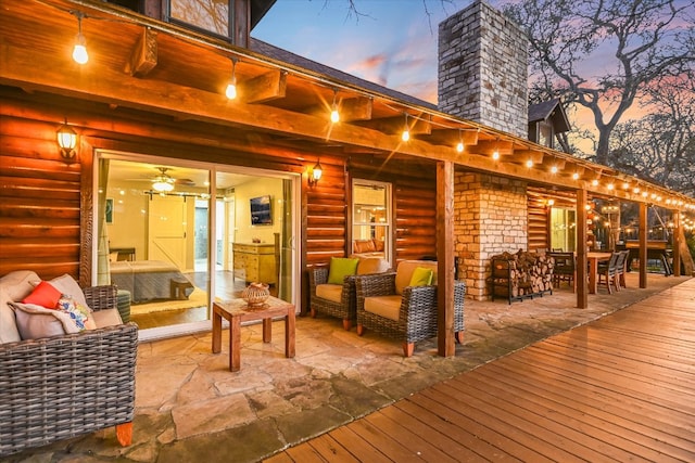 wooden deck with a patio area and outdoor lounge area