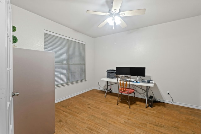 home office featuring ceiling fan, baseboards, and wood finished floors