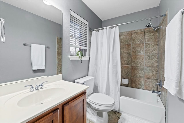 bathroom featuring toilet, tile patterned floors, shower / tub combo with curtain, and vanity