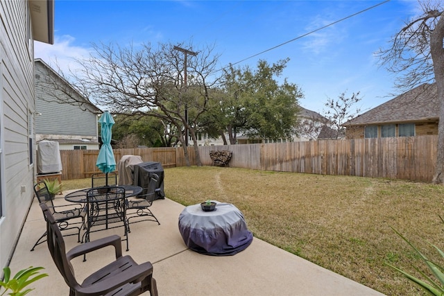 view of patio featuring outdoor dining area and a fenced backyard