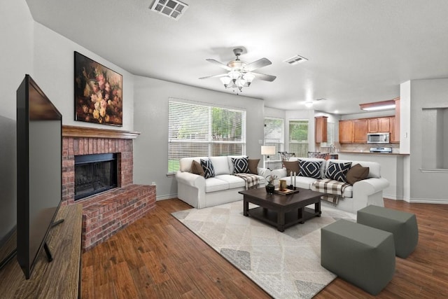 1532 Homewood Cir, Round Rock, TX 78665 - living room featuring wood finished floors, ceiling fan, a fireplace, and baseboards