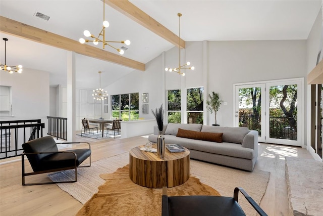 living area with high vaulted ceiling, a chandelier, beamed ceiling, and wood finished floors