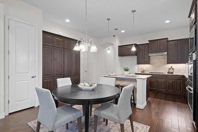 dining space featuring dark wood-style flooring, visible vents, and recessed lighting