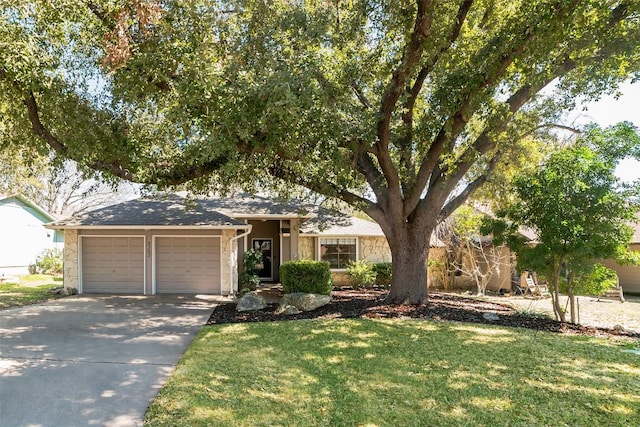 ranch-style house featuring a garage, stone siding, concrete driveway, and a front yard