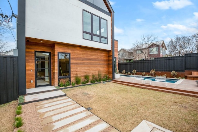 view of yard featuring a fenced in pool, a patio area, and a fenced backyard