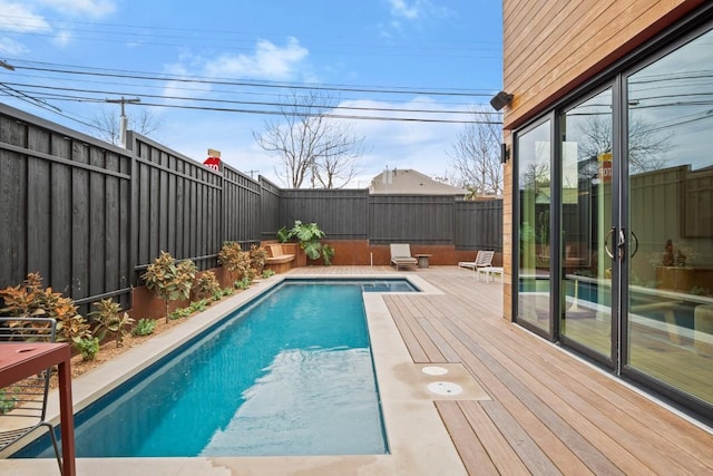 view of swimming pool with a fenced backyard and a fenced in pool