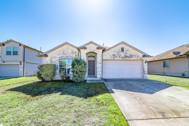 french country style house with a front lawn, an attached garage, and driveway