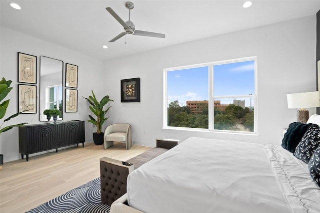 bedroom with light wood-style floors, baseboards, a ceiling fan, and recessed lighting