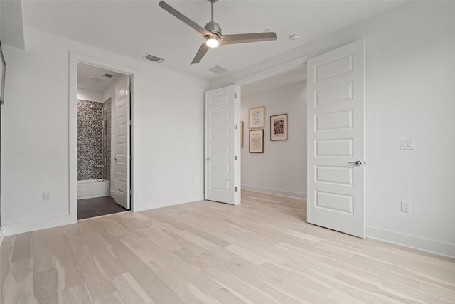 unfurnished bedroom featuring light wood-type flooring, visible vents, and baseboards