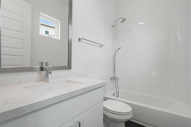 full bathroom featuring toilet, bathing tub / shower combination, and vanity