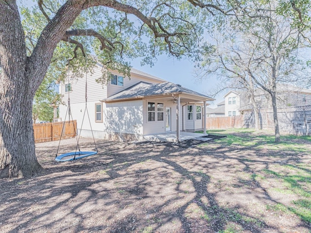 back of house with a patio area and fence