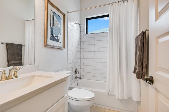 bathroom featuring shower / bath combo, vanity, and toilet