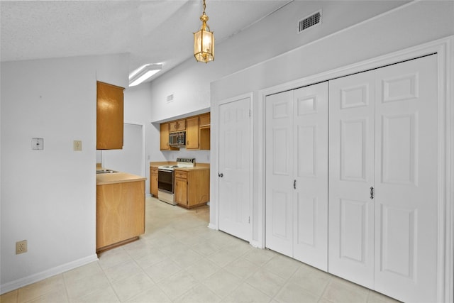 kitchen featuring white electric range, visible vents, light countertops, brown cabinets, and stainless steel microwave