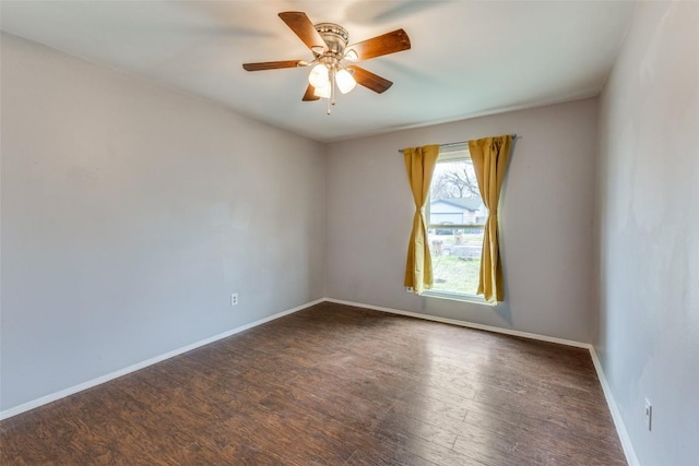 unfurnished room with ceiling fan, baseboards, and wood finished floors