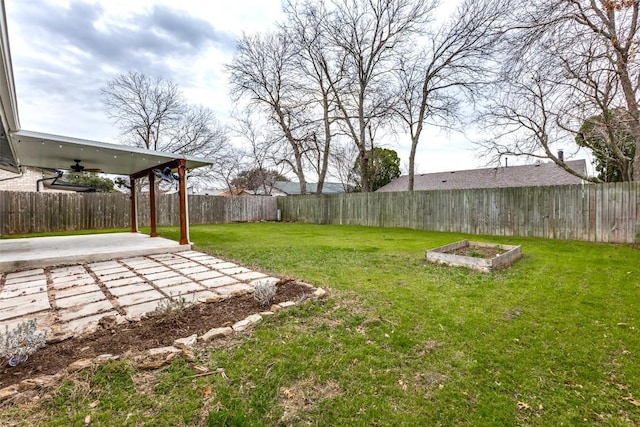 view of yard featuring ceiling fan, a patio, and a fenced backyard