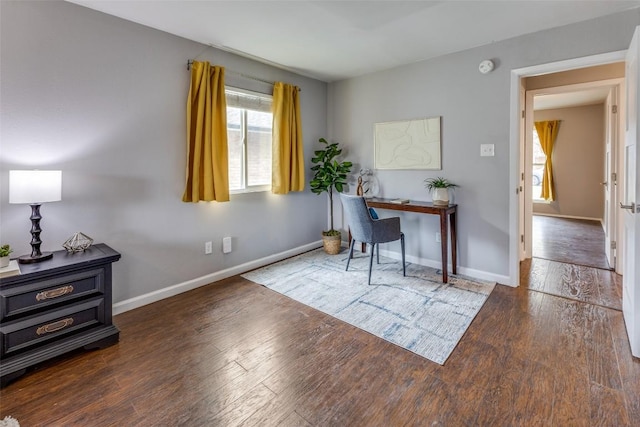 office space with hardwood / wood-style floors and baseboards