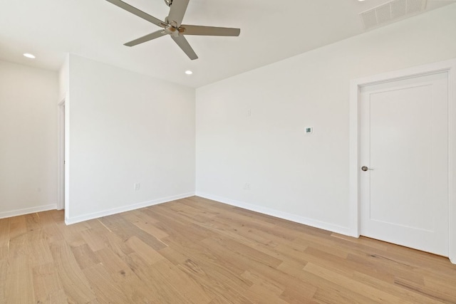 spare room with light wood-style flooring, visible vents, baseboards, and recessed lighting