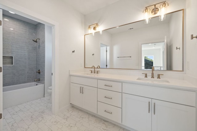11009 Fourth St, Jonestown, TX 78645 - full bath with double vanity, toilet, marble look tiles, tub / shower combination, and baseboards