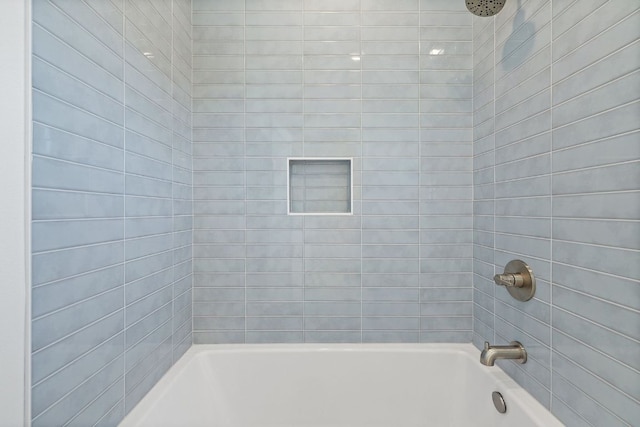 bathroom with shower / bathing tub combination