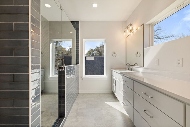 full bathroom with recessed lighting, walk in shower, tile patterned flooring, and vanity