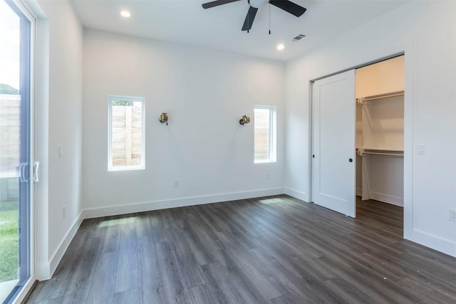 unfurnished bedroom with dark wood-type flooring, recessed lighting, and baseboards