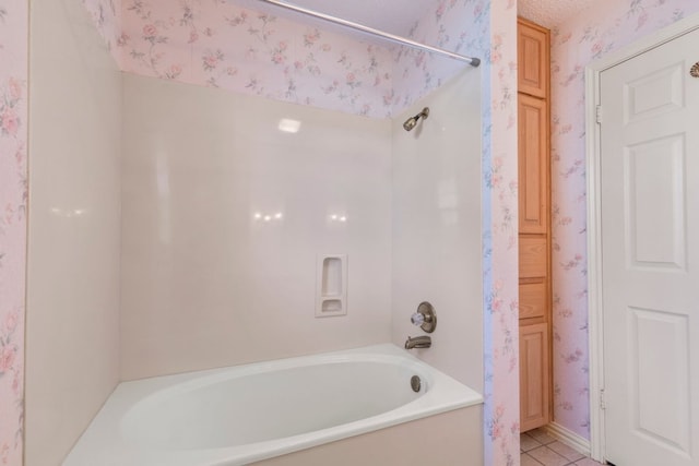 full bath with tub / shower combination, tile patterned floors, and wallpapered walls