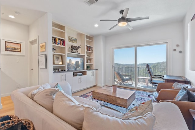 1741 Spyglass Dr Unit 1-232, Austin, TX 78746 - living area featuring light wood finished floors, a ceiling fan, recessed lighting, and built in shelves