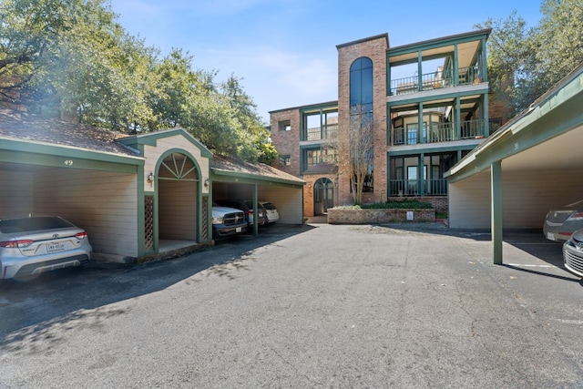 view of front of property with covered parking