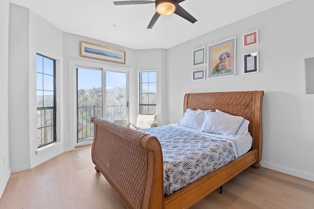 bedroom featuring ceiling fan, access to outside, light wood finished floors, and baseboards