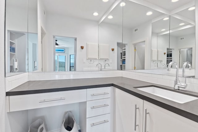 full bathroom featuring visible vents, decorative backsplash, ceiling fan, vanity, and recessed lighting