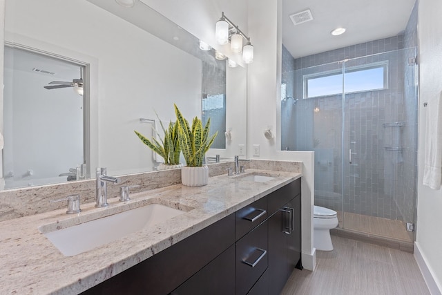 full bath featuring visible vents, a sink, a shower stall, and toilet