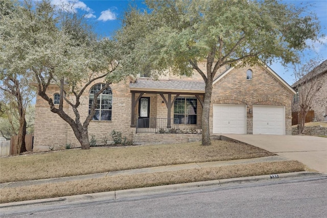 ranch-style house with covered porch, brick siding, driveway, and an attached garage