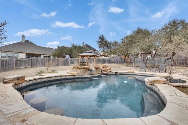 view of swimming pool featuring a fenced in pool, a fenced backyard, and a gazebo